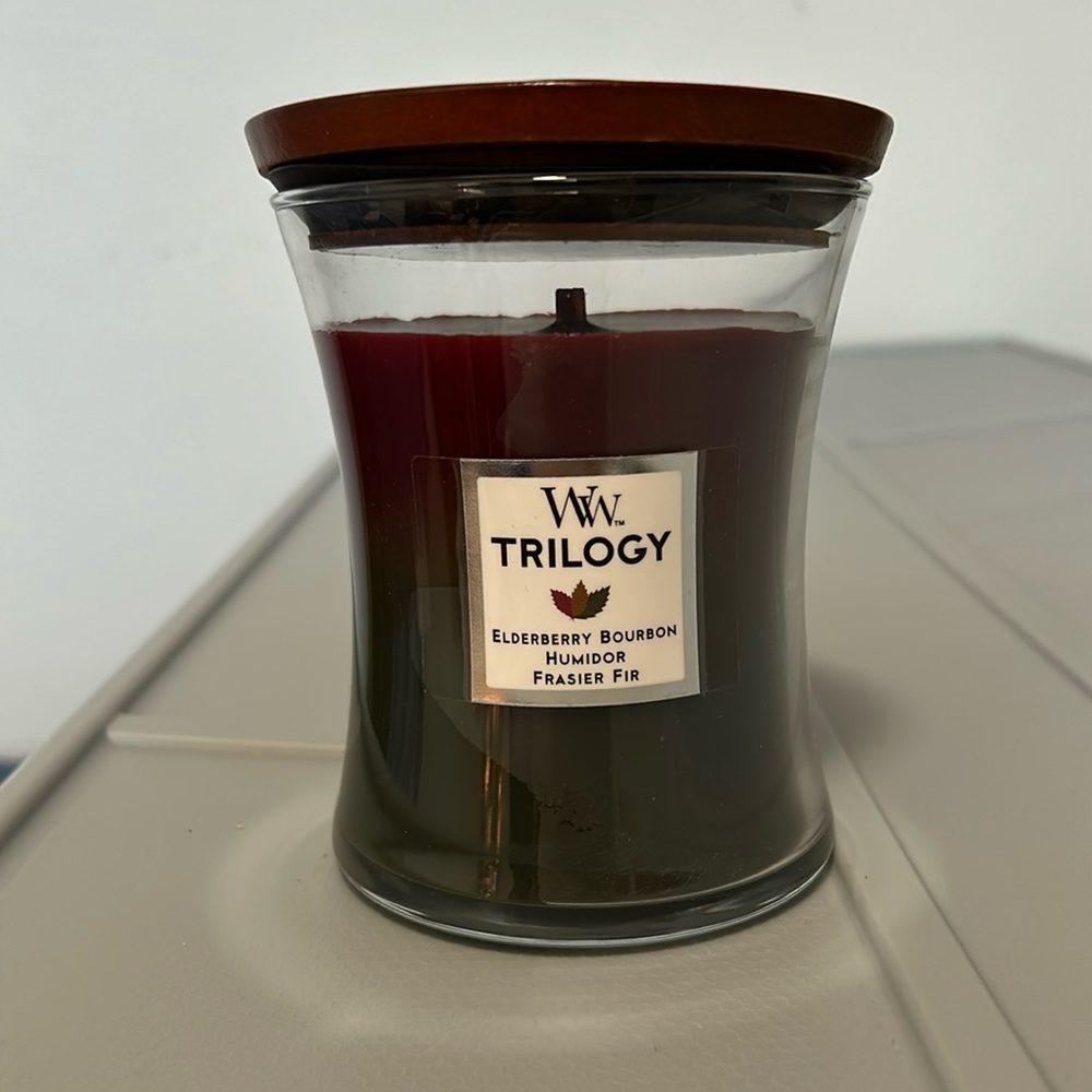 Brand new Wood Wick 9.7 ounce candle. Hearthside scented candle